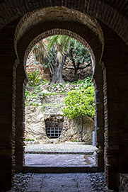 Málaga, Archway in Moorish Fortress  (Gibralfaro) overlooking town.
